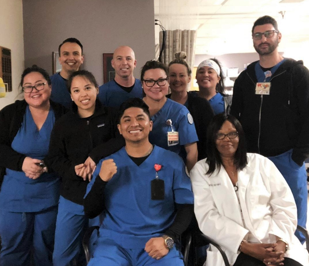 Diverse group of nursing students and their instructor in hospital setting